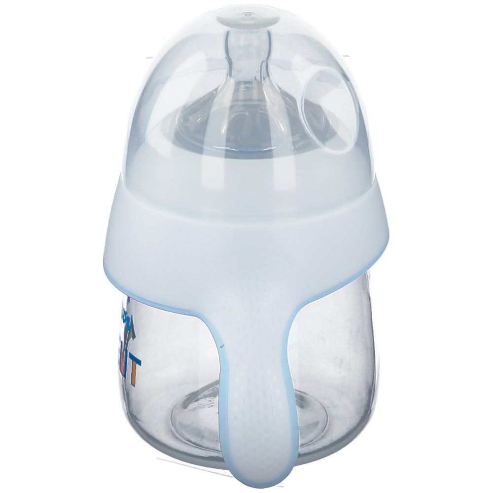 Tazza trainer con manici. Contenitore trasparente, coperchio e manico bianchi. Marchio Philips Avent.