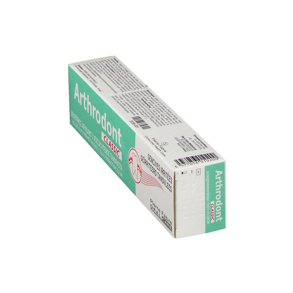 Scatola di dentifricio verde e bianca. Scritta "Arthrodont Classic".