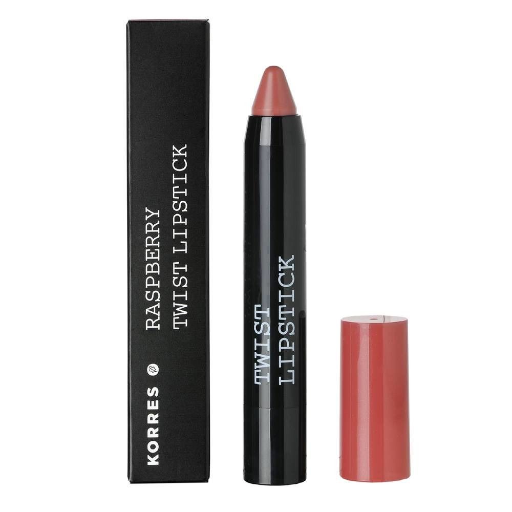 Korres Himbeere Twist Lippenstift Charm. Confezione nera con nome del prodotto. Rossetto rosa, stick nero, cappuccio rosa.