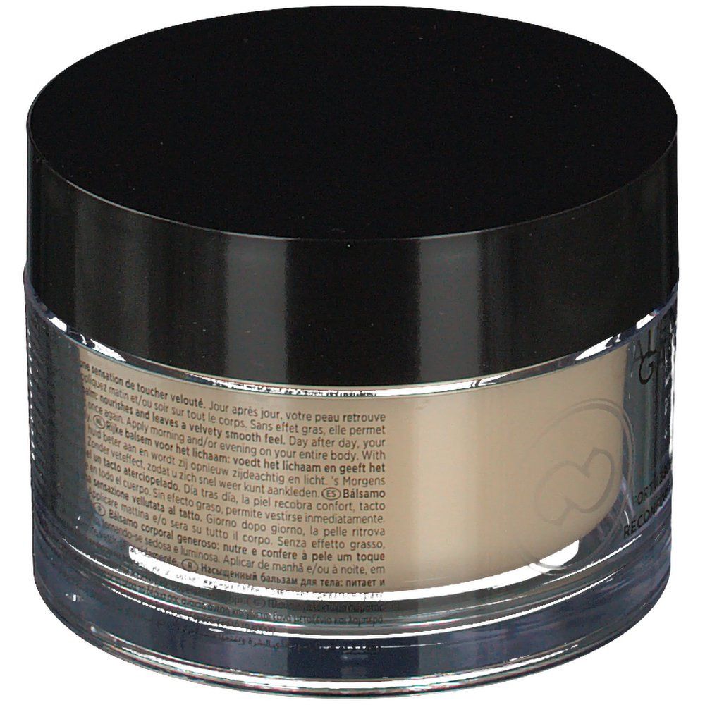 Vaso visto da dietro. Coperchio nero, contenitore trasparente. Testo in più lingue.