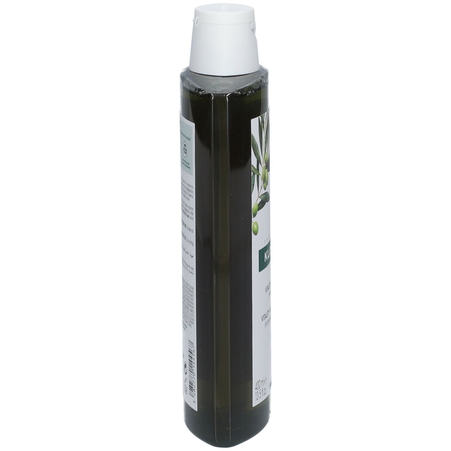 Vista stretta di un flacone di shampoo verde con tappo bianco. Etichetta con testo e illustrazione di olive.