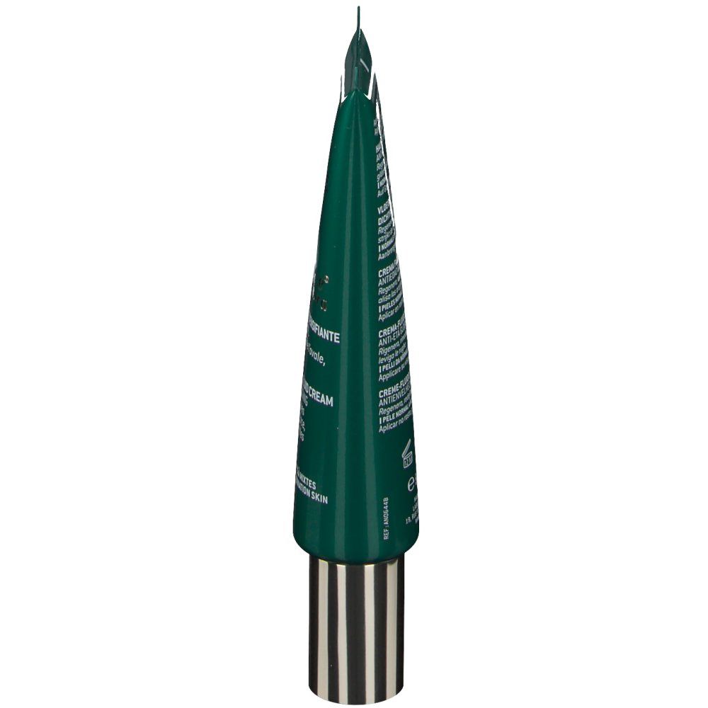 Tubo verde, punta verso l'alto. Scritta: NUXE, Nuxuriance Ultra, Crème-Fluid. Testo in francese e inglese. Chiusura dorata.