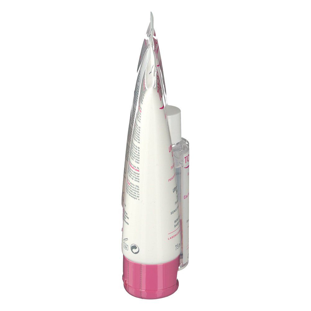 Vista laterale di un tubo cosmetico. Tubo bianco con dettagli rosa. Prodotto in posizione verticale.