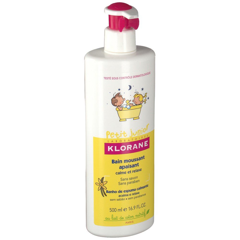 Flacone bianco con erogatore rosa. Etichetta gialla con testo e illustrazioni. Scritta: Klorane Petit Junior, bagno schiuma calmante.
