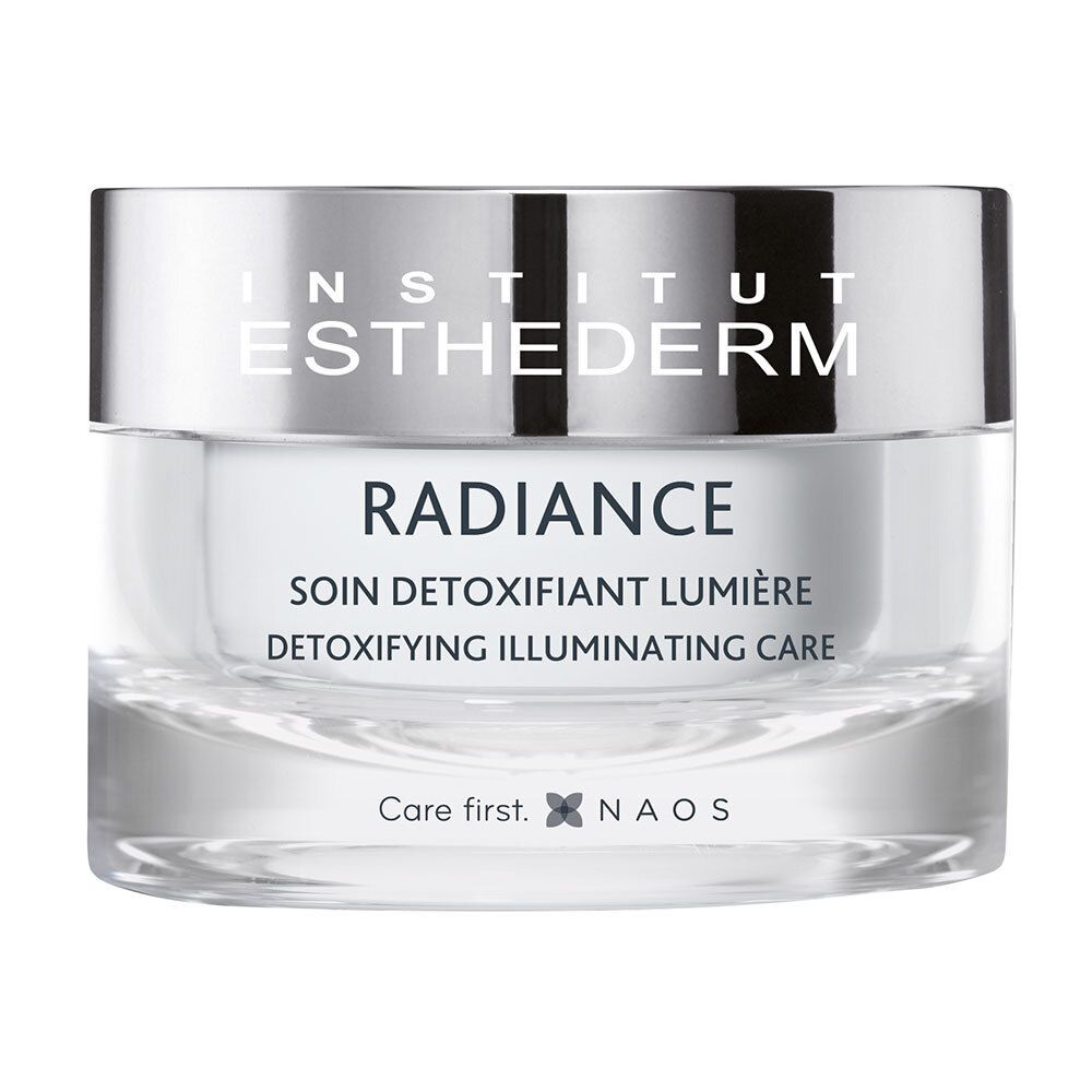 Vasetto di vetro con contenuto bianco. Scritta: INSTITUT ESTHEDERM, RADIANCE, SOIN DÉTOXIFIANT LUMIÈRE, DETOXIFYING ILLUMINATING CARE.