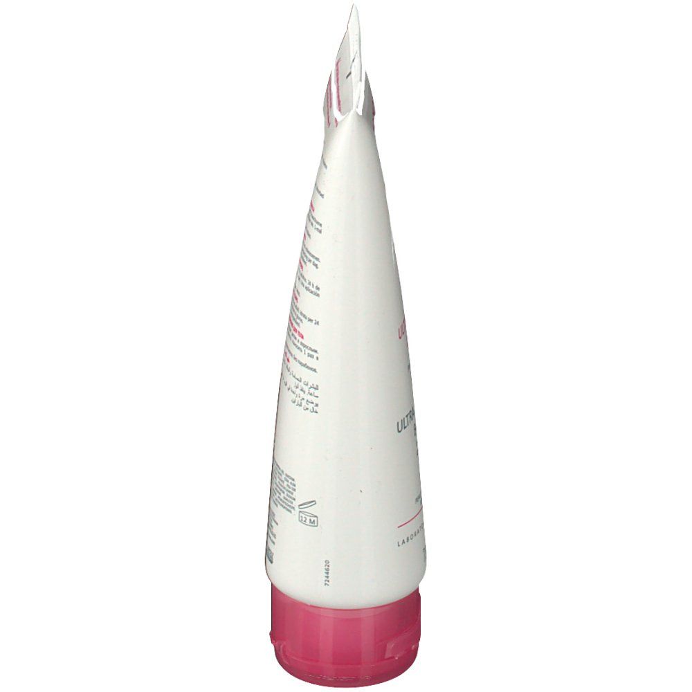 Tubo bianco, vista laterale. Tappo rosa. Testo e simboli.