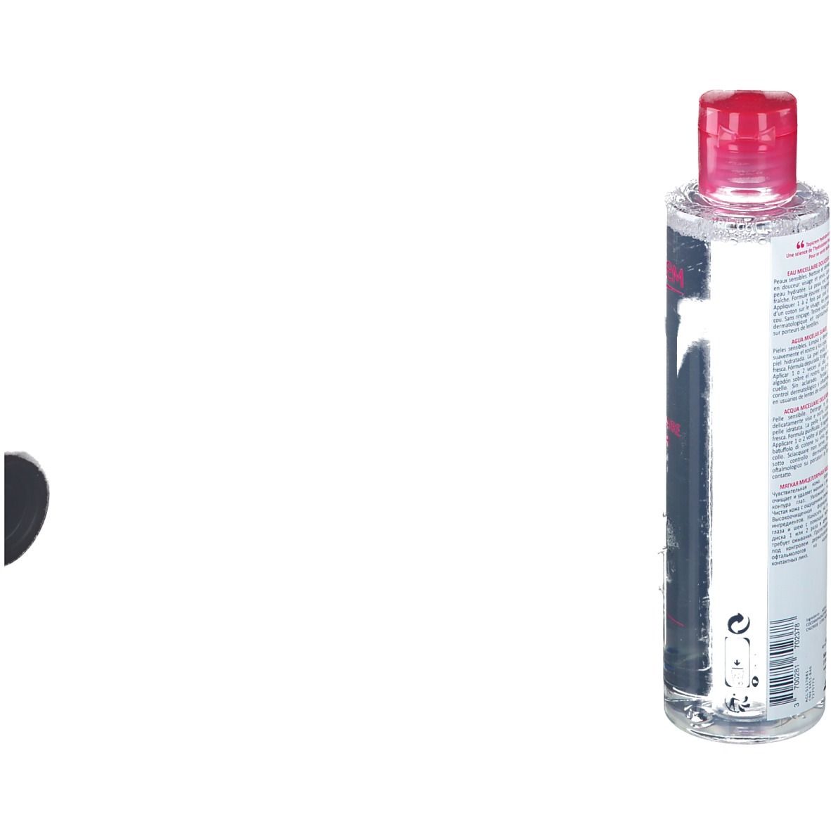 Flacone cilindrico con tappo rosa. Scritte sul retro. Etichetta con informazioni sul prodotto.