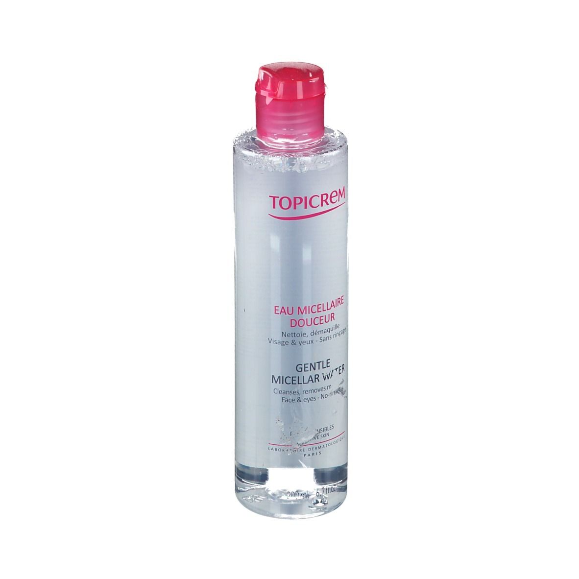 Liquido trasparente in flacone cilindrico con tappo rosa. Scritte: TOPICREM, Eau Micellaire Douceur, Gentle Micellar Water.