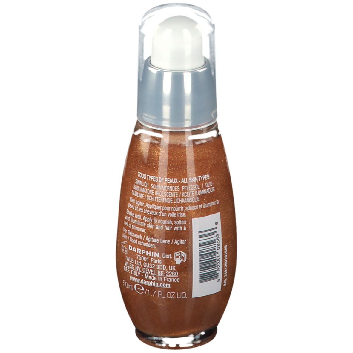 Vista posteriore del flacone di olio. Tappo trasparente, collare argentato, olio marrone. Testo: Tous types de peaux, 50ml, Agitare prima dell'uso.