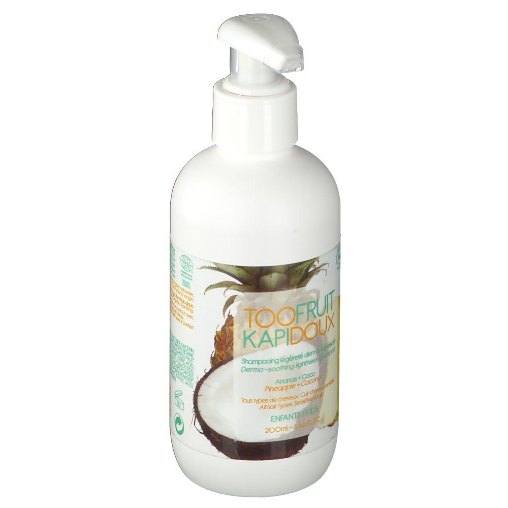 Flacone bianco con dosatore. Etichetta con testo, illustrazioni di ananas e cocco. Nome del prodotto visibile.