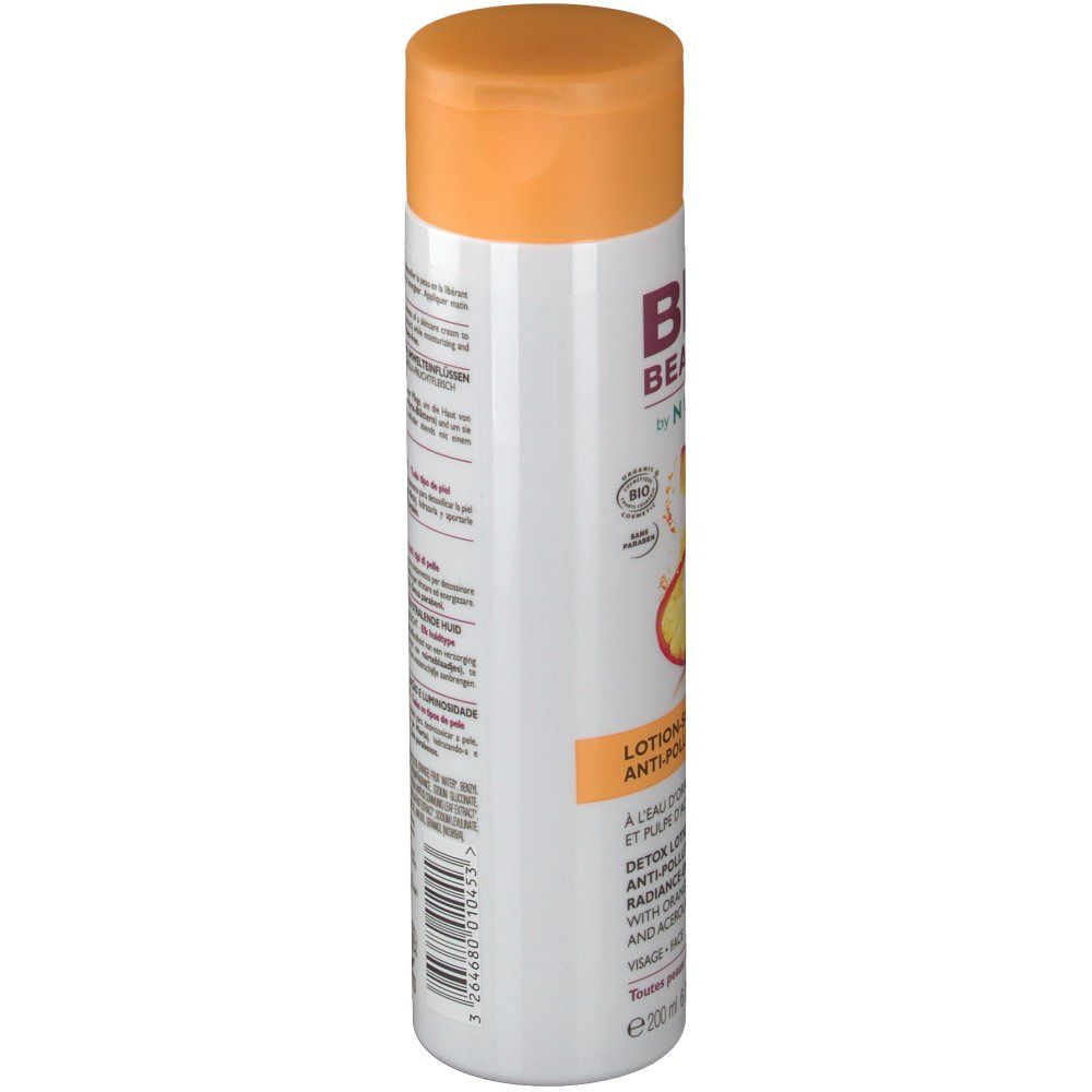 Flacone bianco con tappo arancione. Scritta: BIO BEAUTÉ by NUXE. Lotion-soin détox. Con acqua d'arancia e polpa di acerola.