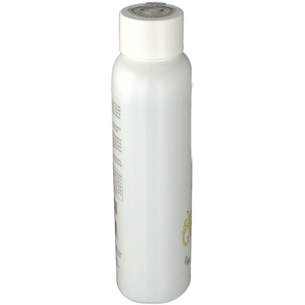 Flacone di shampoo bianco, vista laterale. Etichetta con testo. Tappo bianco.