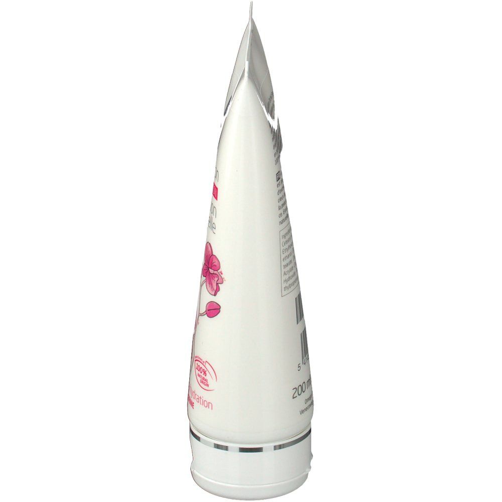 Vista laterale di un tubo bianco. Contiene testo e un'illustrazione di orchidea.