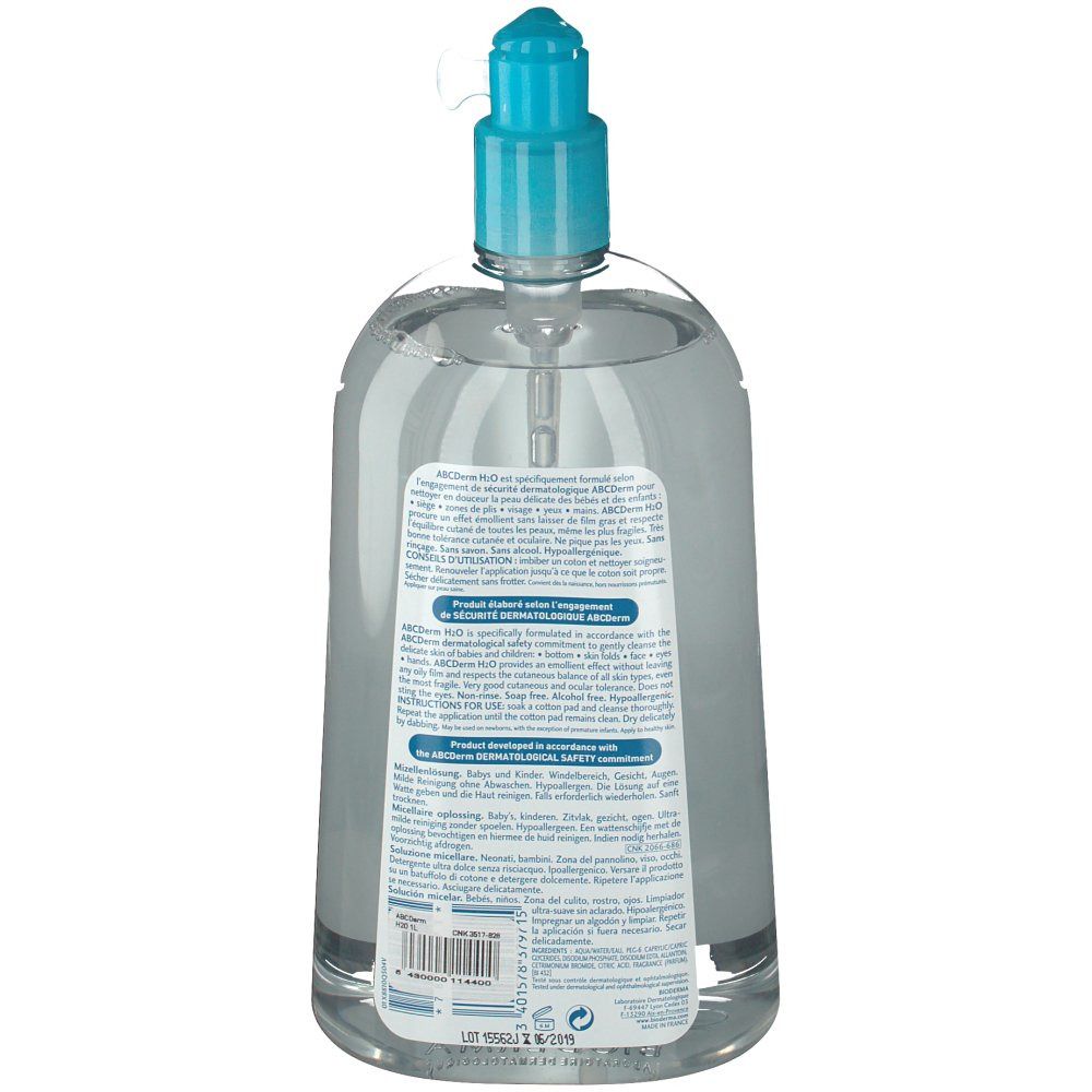 Vista posteriore di un flacone trasparente con tappo a pompa blu. Testo sull'etichetta, informazioni sul prodotto e codice a barre.