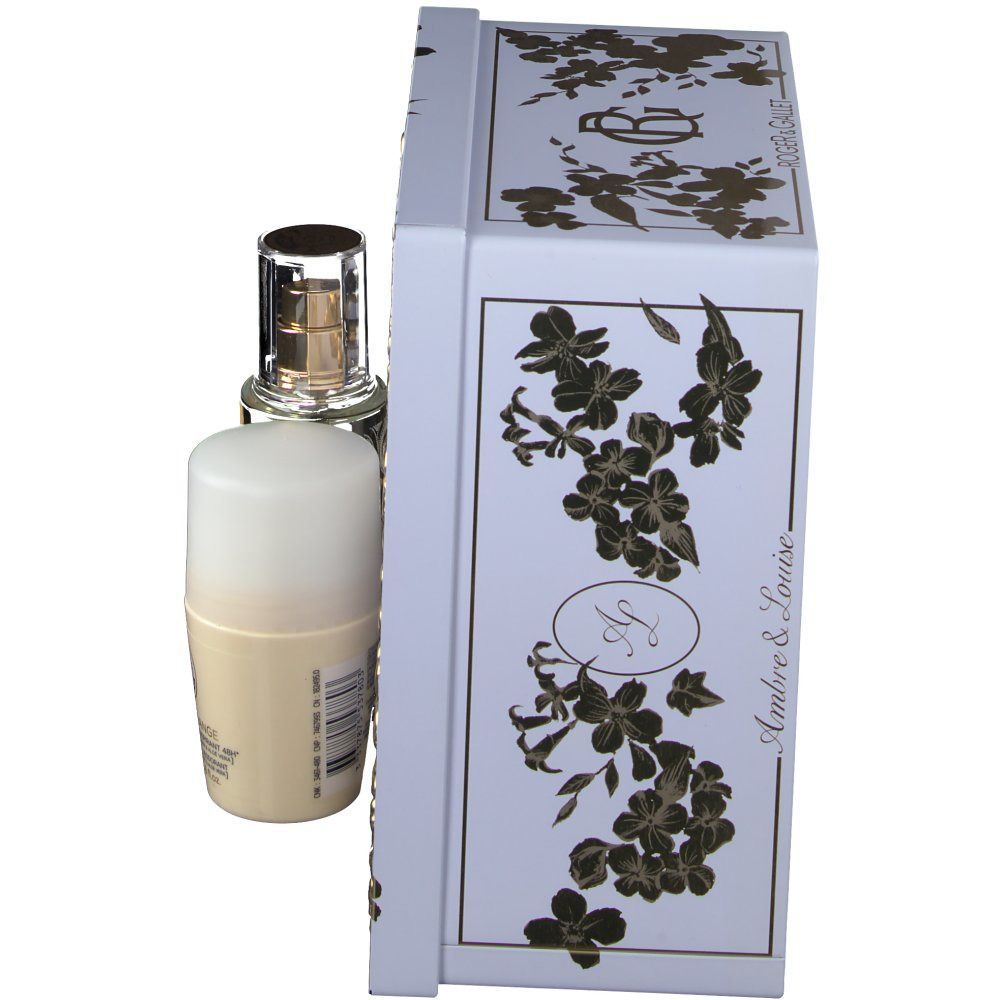 Set regalo con flacone e deodorante accanto a una scatola bianca. La scatola ha motivi floreali dorati e il nome del marchio.