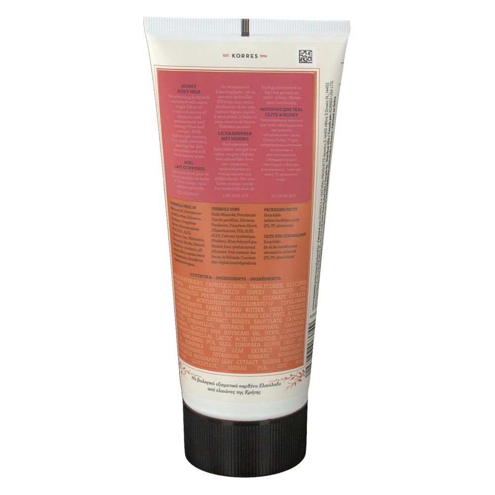 Retro del tubo. Testo in più lingue. Aree di colore rosa e beige. Tappo nero.