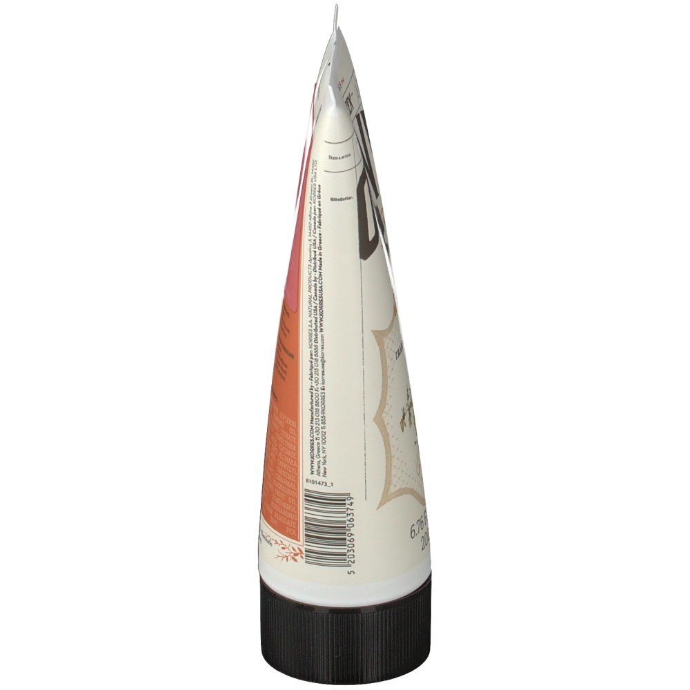 Vista laterale del tubo. Bianco, con testo e area rosa. Tappo nero. Punta chiusa.