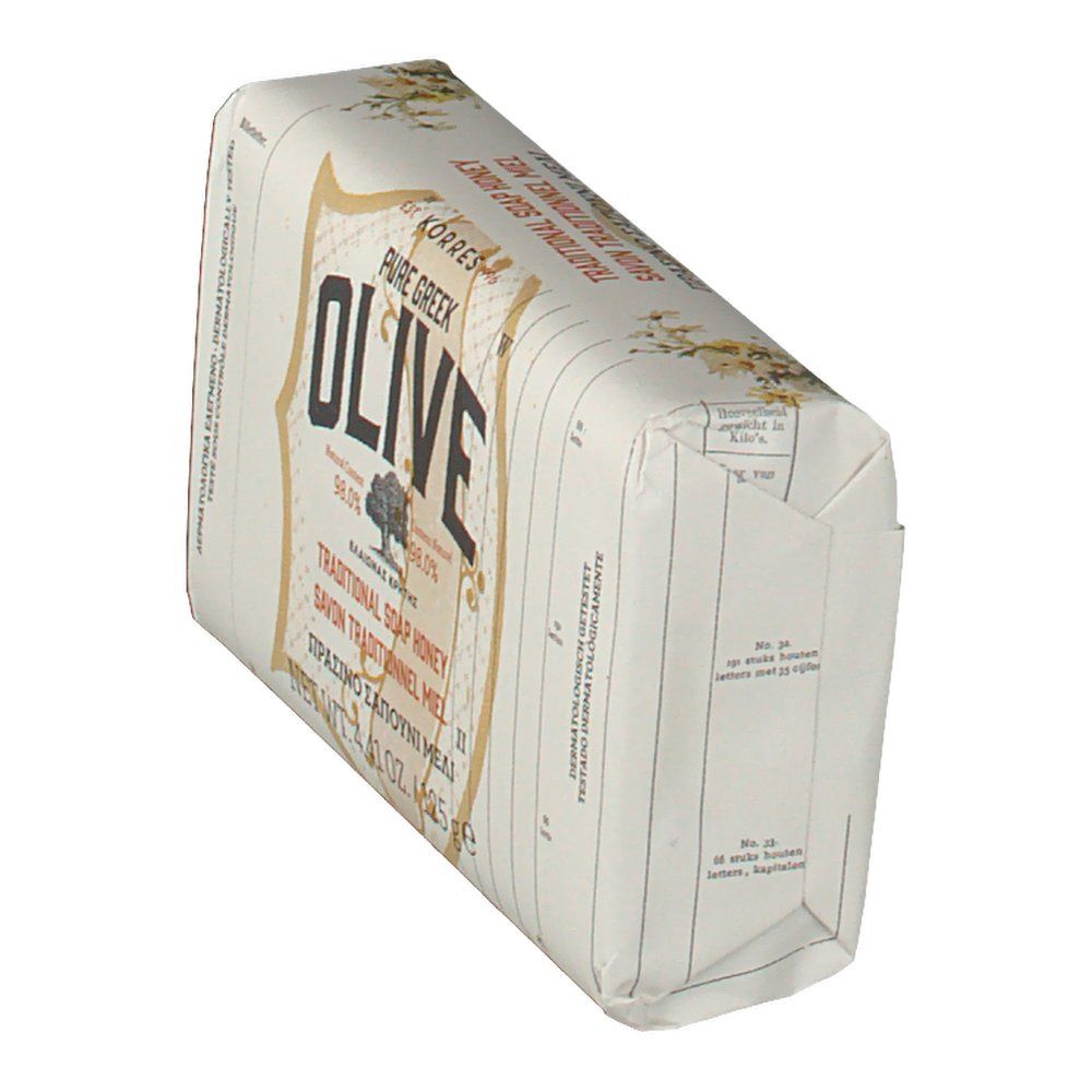 Sapone inclinato nella sua confezione. Scritta OLIVE, marchio Korres. Testo multilingue.