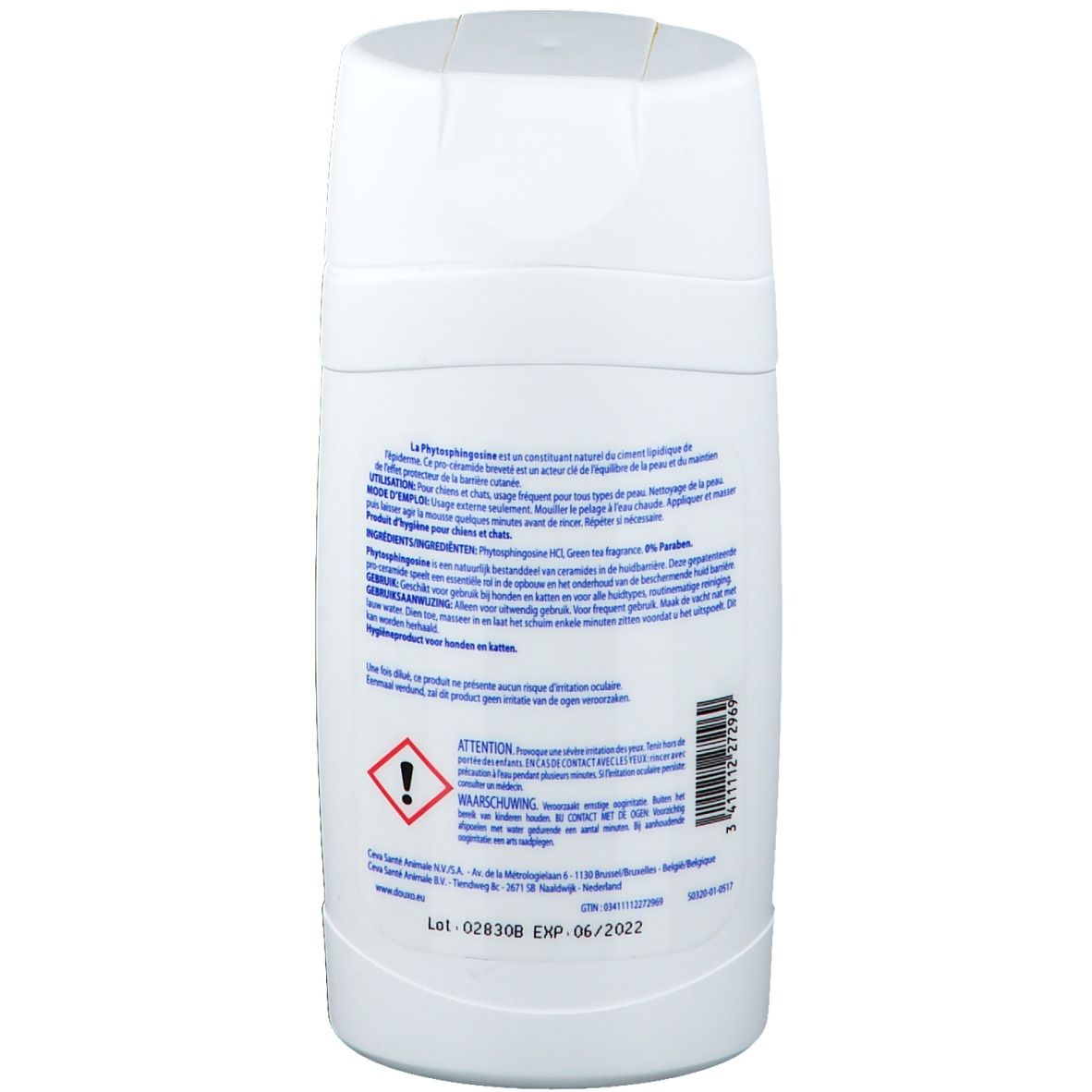 Retro del flacone di shampoo bianco con testo e simboli di avvertimento. Contiene informazioni sul prodotto.