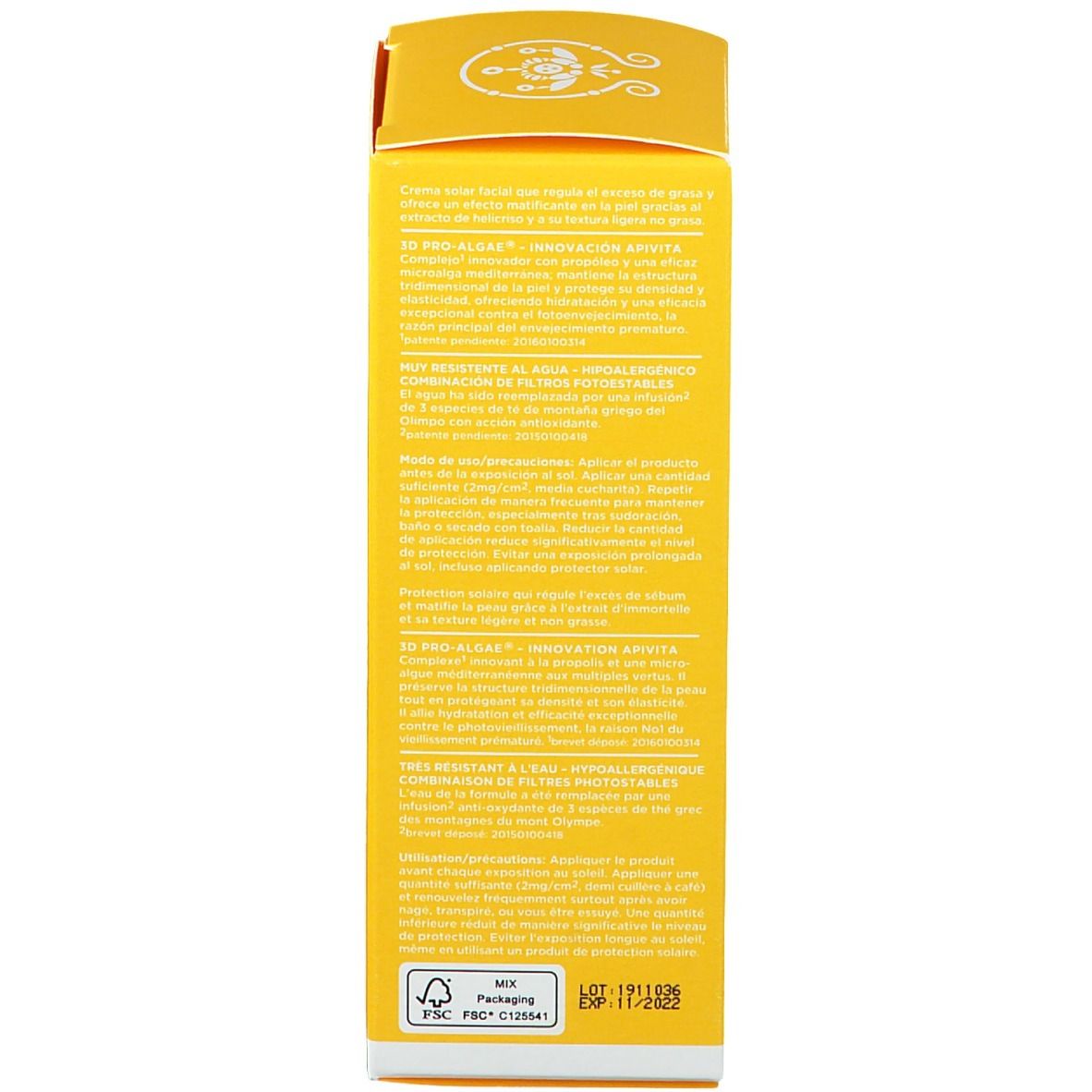 Retro di una scatola di crema solare gialla. Testo con informazioni sul prodotto e ingredienti.