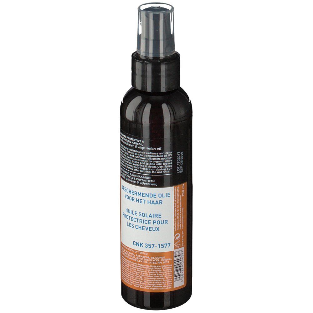 Flacone scuro con vaporizzatore. Retro con testo multilingue. CNK 357-1577.