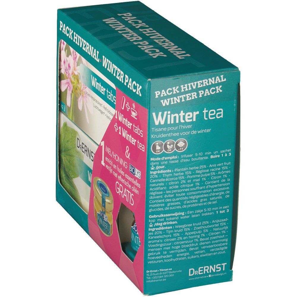 Vista obliqua di Dr. Ernst Winter Pack. Contiene compresse, tè e miele con oli essenziali. Testo: Winter Pack.