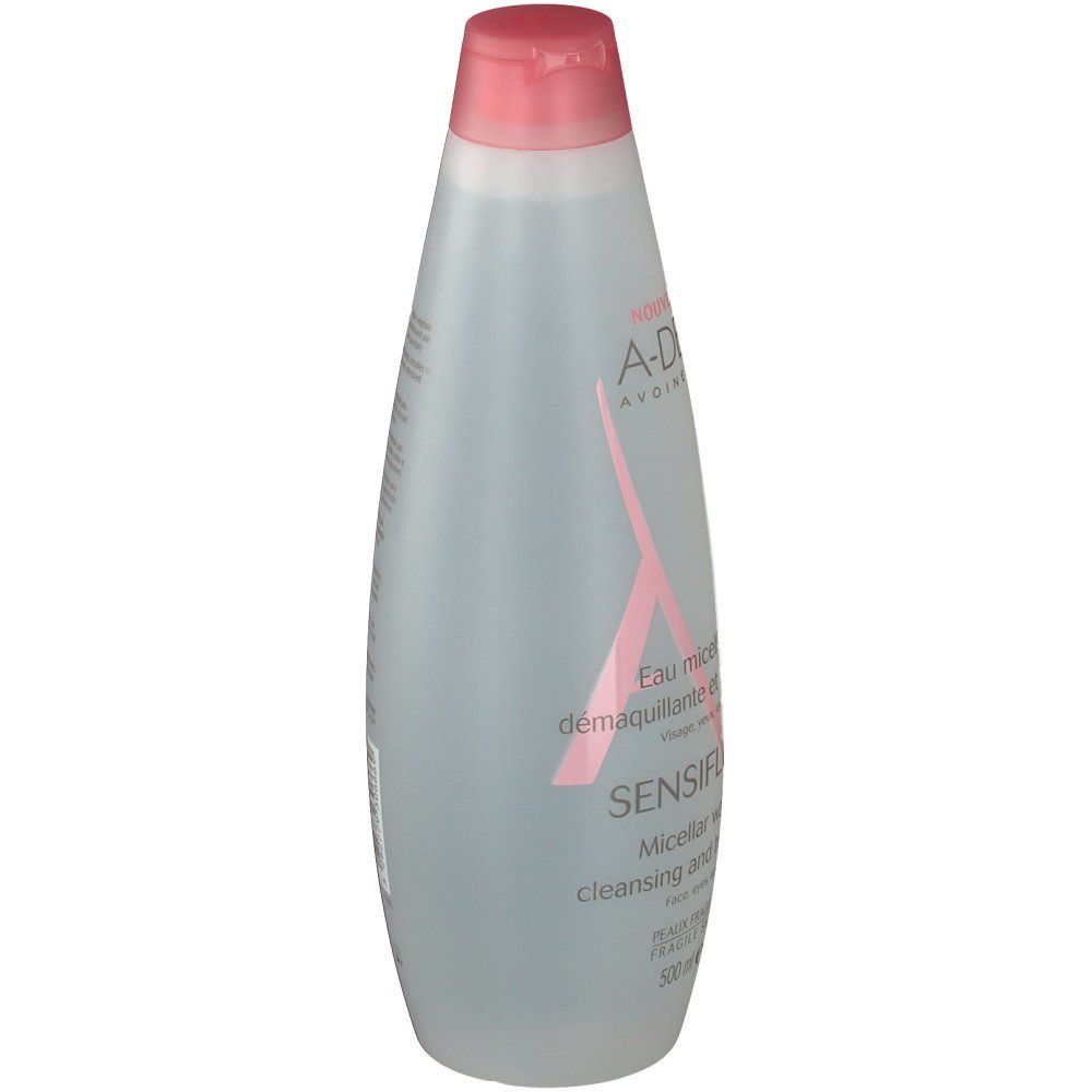 Flacone trasparente con tappo rosa. Logo A-DERMA e nome del prodotto SENSIFLUID. Testo sul flacone.