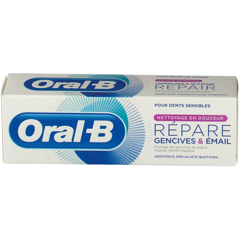 Confezione di dentifricio. Bianca, con logo e testo blu. "Réparer gencives & émail" e "Oral-B" visibili.