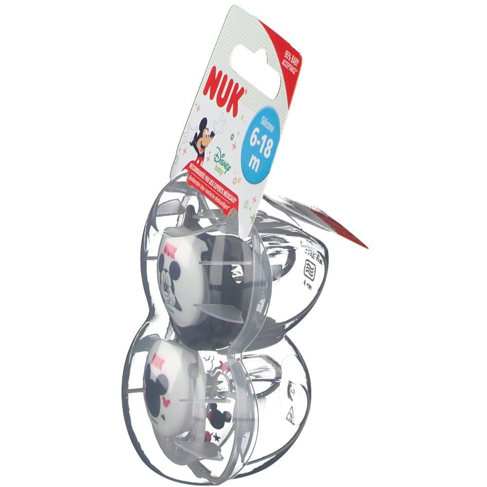 Due ciucci in confezione trasparente. La confezione mostra il logo NUK, Mickey Mouse e l'indicazione dell'età.