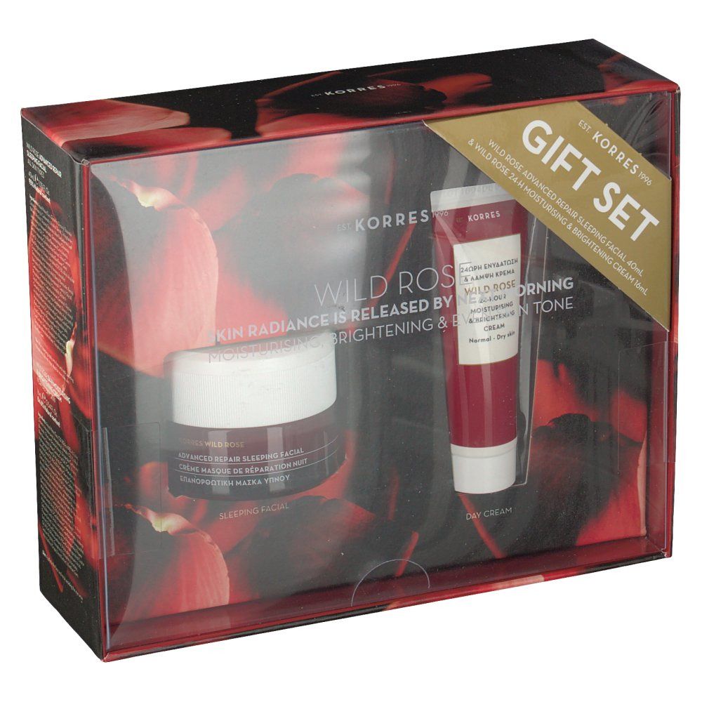 Set regalo con due prodotti cosmetici. Un vasetto e un tubetto in confezione rossa con coperchio trasparente. Testo: Wild Rose, Gift Set.