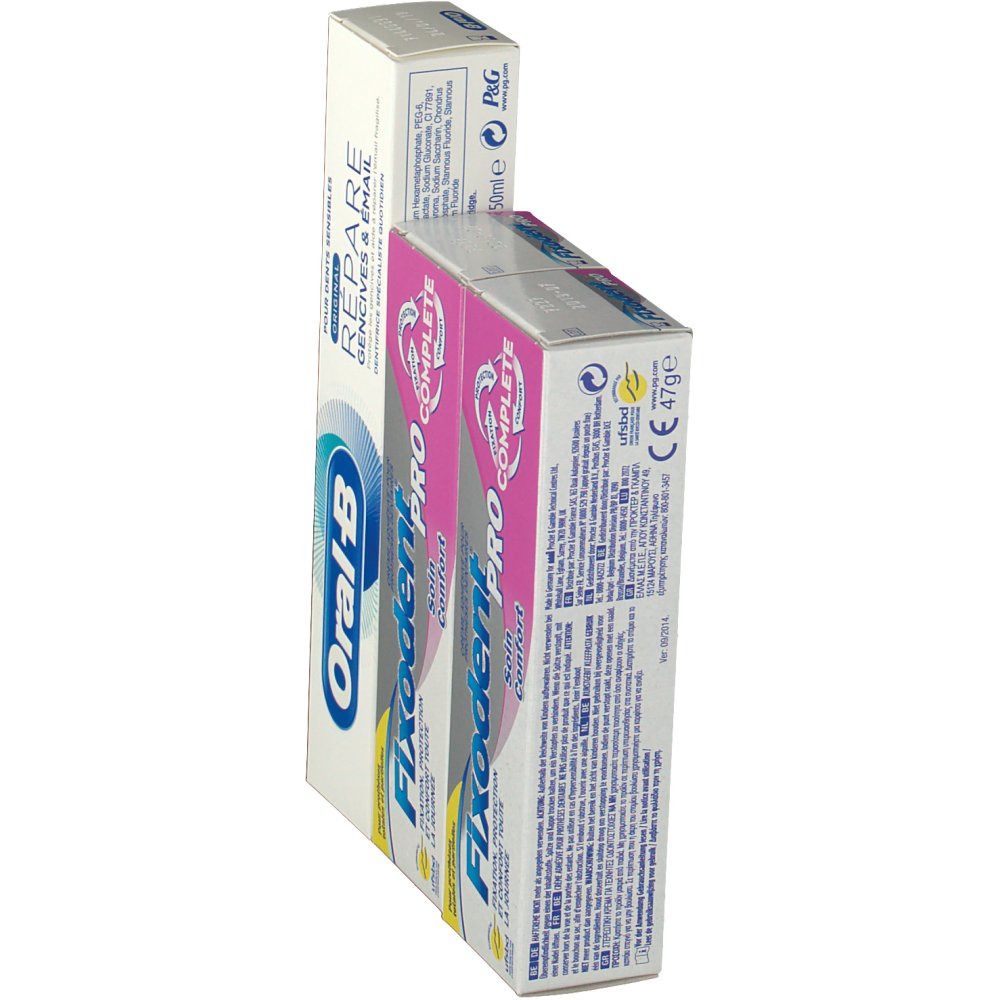 Confezioni di dentifricio e crema adesiva. Dentifricio Oral-B e due confezioni Fixodent Pro Complete. Vista angolata.
