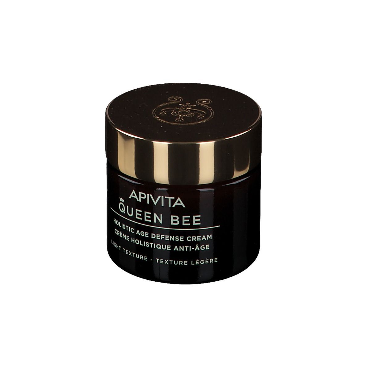 Vaso scuro con coperchio dorato. Scritta: APIVITA Queen Bee. Testo in inglese e francese.