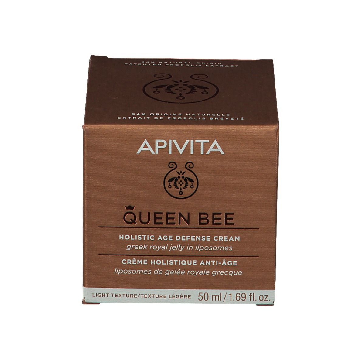Scatola di cartone. Scritta: APIVITA Queen Bee, Holistic Age Defense Cream, 50 ml. Testo in inglese e francese.