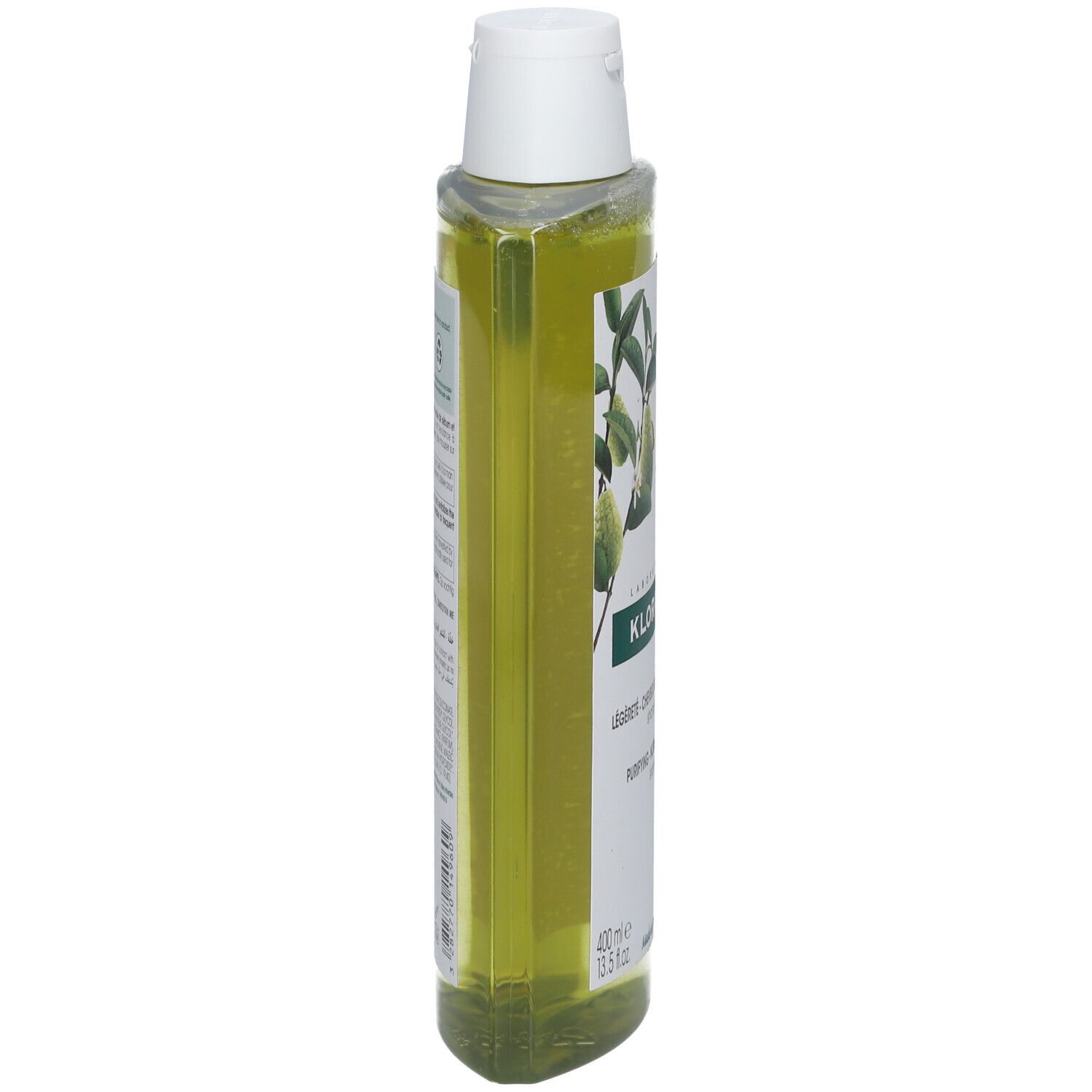 Liquido verde in flacone trasparente con tappo a ribalta bianco. Etichetta con motivo vegetale e testo.