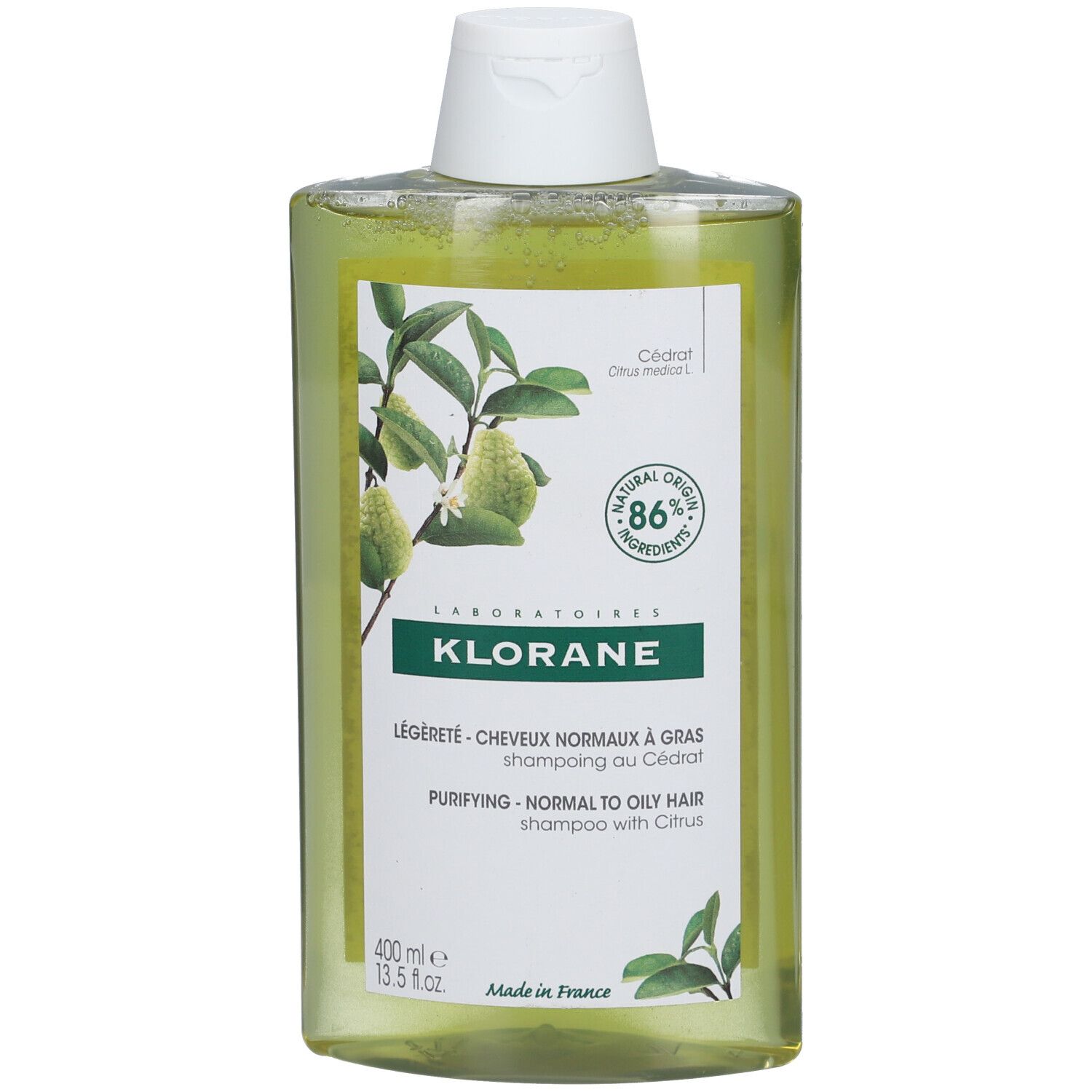 Flacone di shampoo Klorane con motivo agrumi, 400ml. 86% ingredienti naturali.
