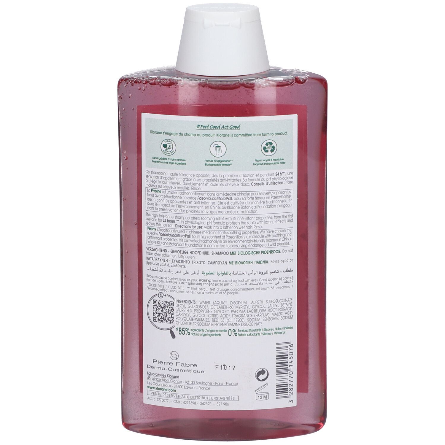 Retro di una bottiglia trasparente con liquido rosa e tappo bianco. Etichetta con informazioni sul prodotto.