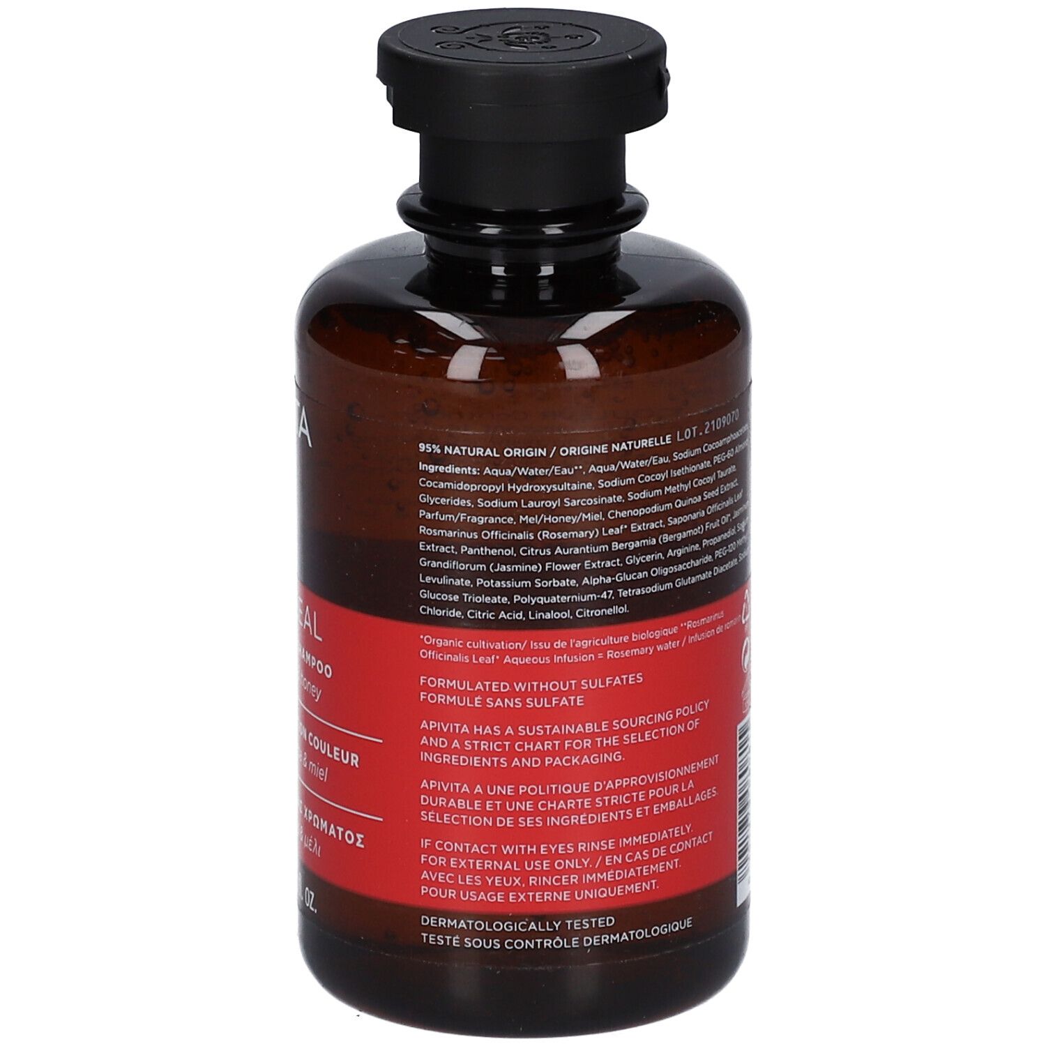 Retro del flacone marrone, tappo nero. Etichetta rossa con testo multilingue. Ingredienti e informazioni.