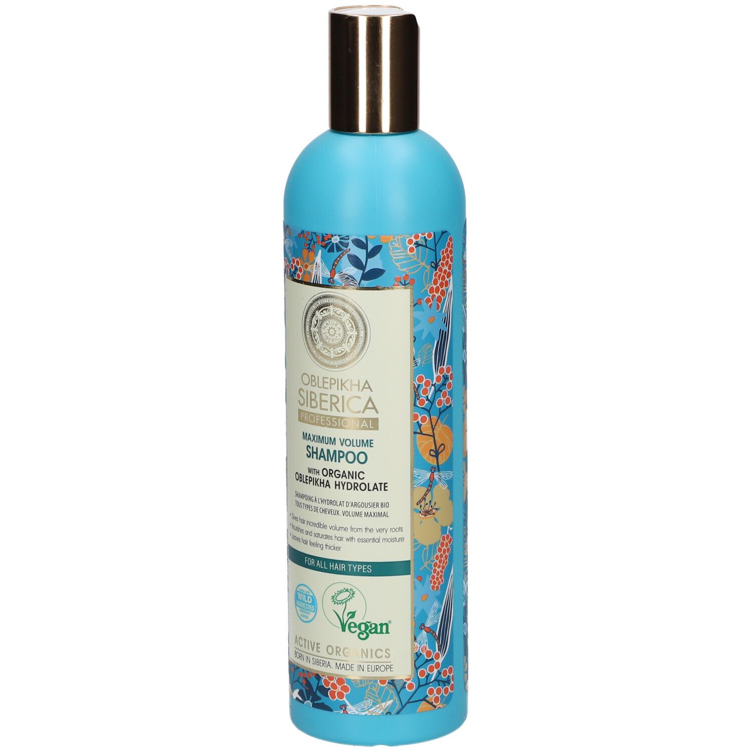 Flacone blu di shampoo volume massimo, con tappo dorato e motivo floreale. Include sigillo vegano.