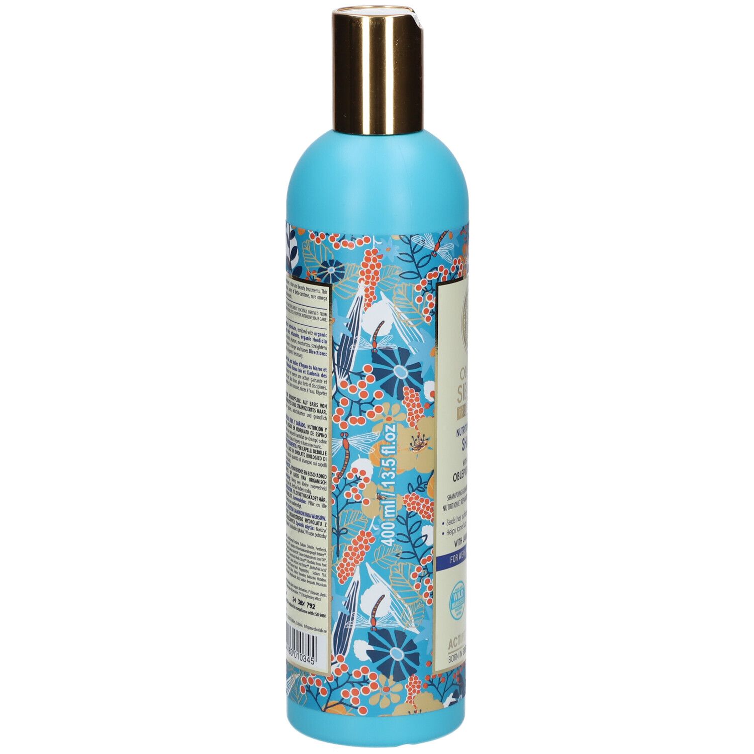 Flacone azzurro con motivi floreali e tappo dorato. Informazioni sul prodotto sul retro.