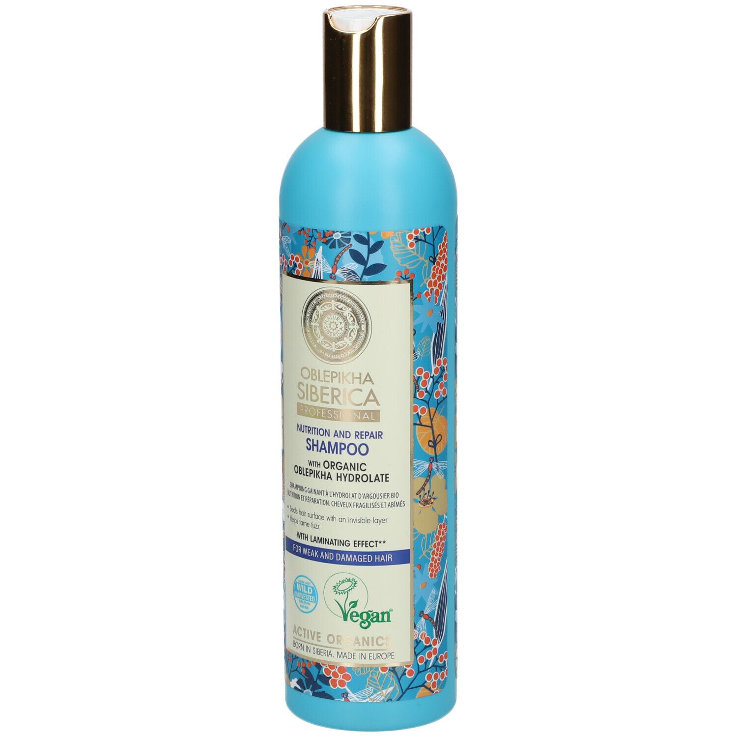 Flacone azzurro con tappo dorato. Etichetta con informazioni sul prodotto. Sigillo vegano.