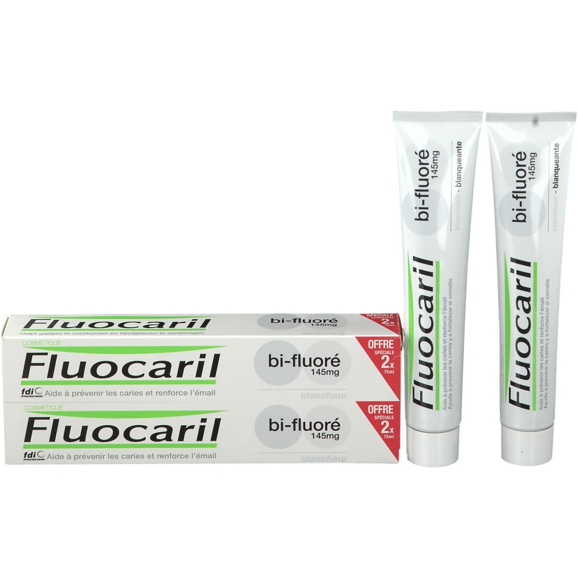 Due tubi e una scatola di dentifricio Fluocaril bi-fluoré. Confezione bianca e verde. Contiene 145mg di fluoruro.