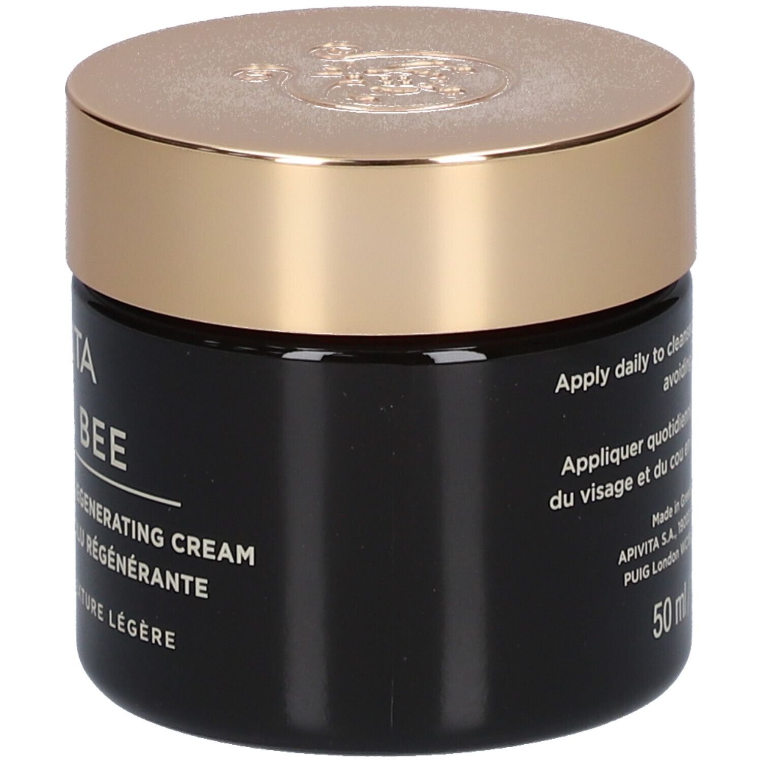 Vaso scuro con coperchio dorato. Scritta: APIVITA QUEEN BEE Absolute Anti-Aging Creme.