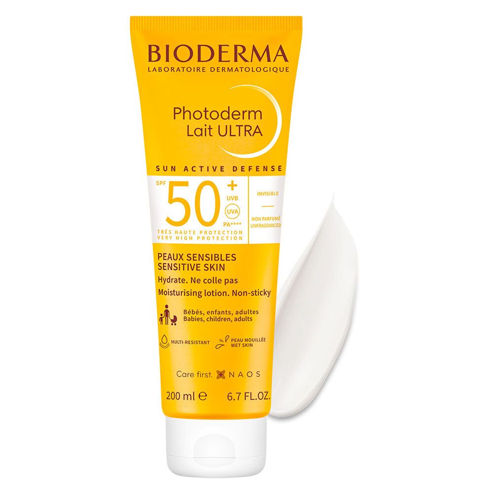 Tubo giallo con nome prodotto e SPF 50+. Accanto, una goccia di crema.