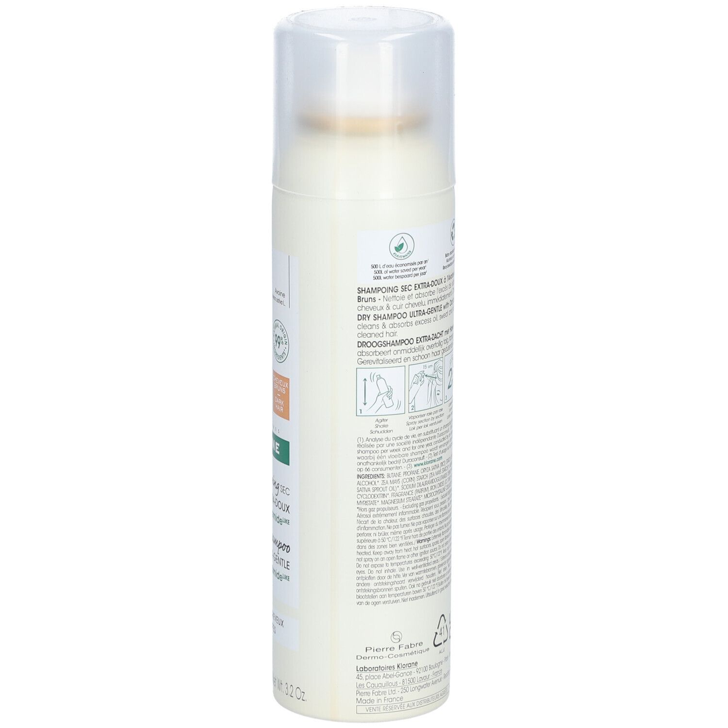 Flacone spray bianco con tappo trasparente, etichettato 'Dry Shampoo'.