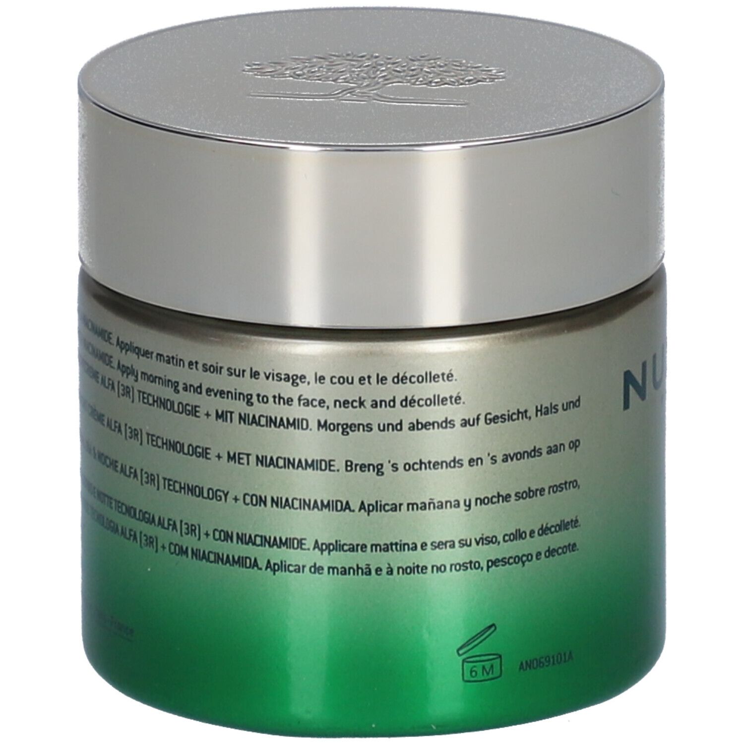 Vaso di crema con coperchio argentato. Scritta NUXE PARIS. Sfumatura verde-oro. Testo in più lingue.