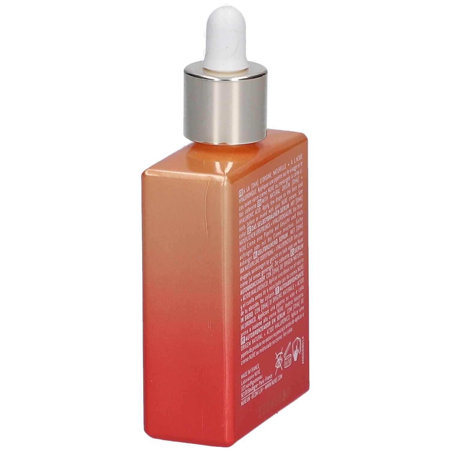 Siero autoabbronzante Nuxe Prodigieuse Boost. Vista laterale del flacone con testo. Sfumatura arancione e rossa.