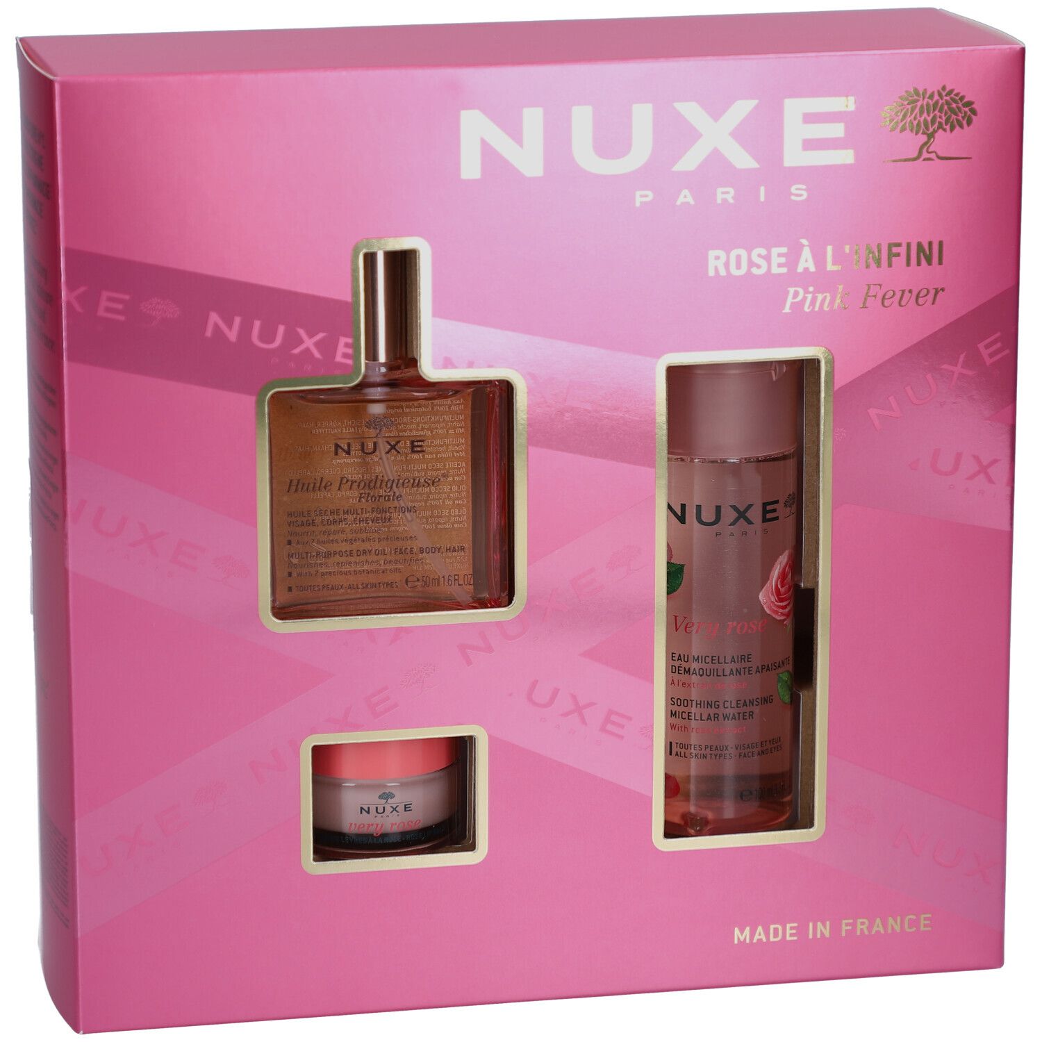 Confezione regalo rosa con tre prodotti. Visibili: logo Nuxe, nomi dei prodotti e i prodotti stessi.