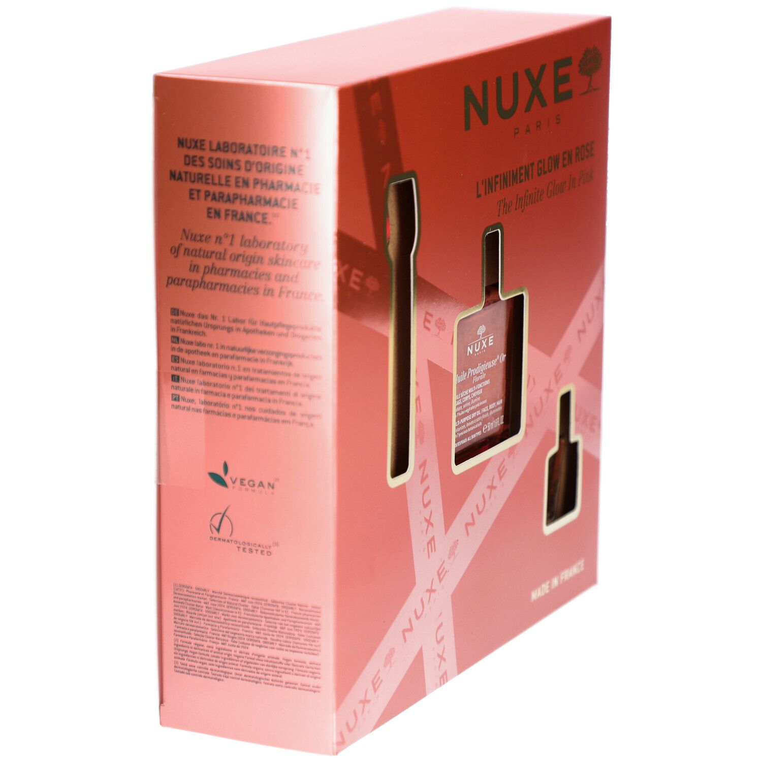 Confezione regalo rosa con testo e logo. Visibile: logo Vegan. Testo: Nuxe Paris, L'Infiniement Glow en Rose, Made in France.