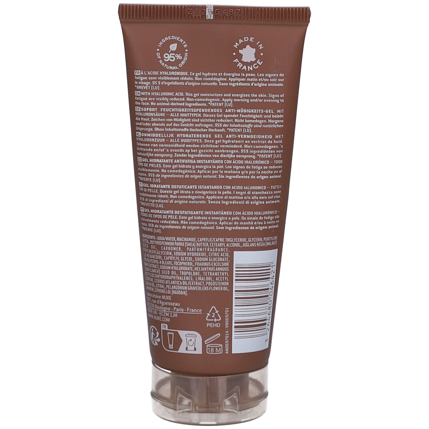 Retro del tubo marrone. Testo multilingue, ingredienti e codice a barre. Chiusura trasparente.