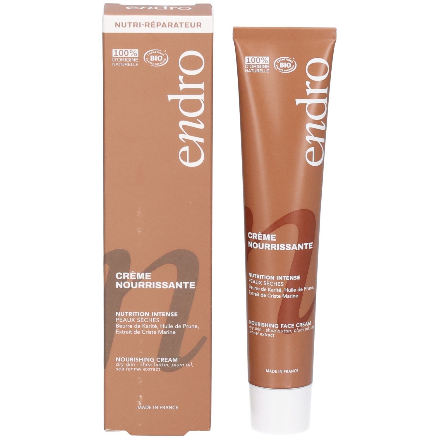 Tubo e scatola di crema viso nutriente Endro. Marrone con scritte bianche.